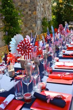 a long table with red, white and blue place settings