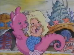 the little mermaid and her pink dragon are in front of a sign that says cafe