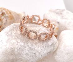 DESCRIPTION: 14k Solid Rose Gold Open Chain Link Ring with Diamonds Metal: 14k rose gold Diamond Information: Quantity: 98 diamonds Weight: 0.25ct Color: H Clarity:SI1-SI2 To see more rings from my collection, please click on the link below : https://www.etsy.com/shop/EderraFineJewelry?ref=hdr_user_menu-shop ABOUT Ederra | Release Your Inner Goddess Gold is one of the oldest metals on this planet. It symbolizes humankind's journey to illuminate and refine oneself. It exerts positive energy and c Adjustable Chain Rose Gold Ring, Fine Jewelry Rose Gold Rings With Adjustable Chain, Rose Gold Chain Ring With Adjustable Chain For Promise, Rose Gold Adjustable Chain Ring For Promise, Elegant Rose Gold Chain Ring With Adjustable Chain, Elegant Adjustable Rose Gold Chain Ring, Rose Gold Chain Ring For Wedding Fine Jewelry, Rose Gold Chain Ring As Gift, Rose Gold Chain Rings As A Gift