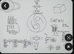 a white board with various symbols and numbers drawn on it, including the number six