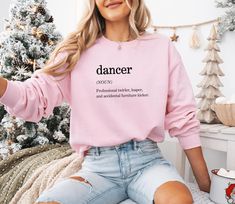 This funny dancer definition sweatshirt is perfect for anyone who lives to dance! Whether you're gifting it to a dance mom, ballerina, or dance teacher, this cozy and playful sweatshirt captures the joy and humor of the dancing life. A great gift for birthdays, holidays, or just to show appreciation for the dancer in your life! Personalization: * Text colors are available in black, white, and white glitter. * White glitter text appears similar to regular white text but sparkles when exposed to s Dance Mom Gifts, Dance Sweatshirt, Ballet Birthday, Ballerina Gift, Glitter Text, Dance Mom, The Dancer, Dance Teacher, Funny Sweatshirts