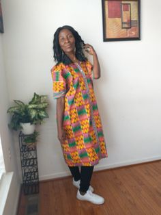 African Handmade oversized Boho kaftan kimono dress top, made with 100% cotton African, kitenge, mud cloth fabric. Dress up or down with this colorful kente kimono dress top. Front open with buttons  Black collar Chest-42" Length-43.5" Around arm-14.5" Multicolor Short Sleeve Kimono, Oversized Cotton Kaftan, Traditional Cotton Tunic Kimono, Traditional Cotton Dress With Kimono Sleeves, Cotton Dresses With Kimono Sleeves, Casual Cotton Kaftan For Daywear, Short Sleeve Cotton Kaftan With Relaxed Fit, Casual Tunic Kaftan, Multicolor One Size Cotton Kimono