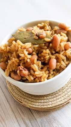 a white bowl filled with rice and beans