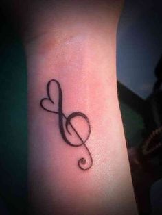 a music note tattoo on the wrist