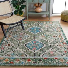 an area rug with a chair and potted plant