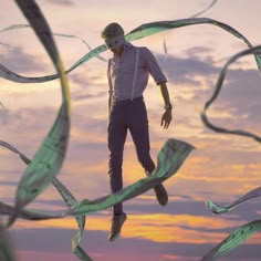 a man is flying through the air with his feet in the air while wearing suspenders