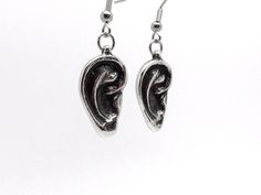 "Another design inspired by the human ear, this time as dangle earrings. The design was carefully carved by hand and we took our time to make it light enough to be comfortable to wear. Each charm weighs approximately 3 grams and is just under 4/5\" (20 mm) long. The charms are cast in lead free pewter after which they are oxidized to fill in the details and then polished. They are delivered with stainless steel earring hooks. To see our necklace pendant version go here: https://www.etsy.com/se-e Adjustable Hand Cast Earrings As Gift, Anatomy Jewelry, Brain Necklace, Human Ear, Bone Ring, Bone Jewelry, Earring Hooks, Stainless Steel Earrings, Favorite Rings