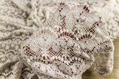 an image of white lace on fabric