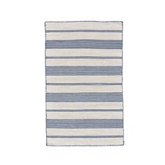 a blue and white striped rug on a white background