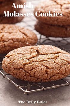 some cookies are cooling on a rack with the words, amish molassses cookies