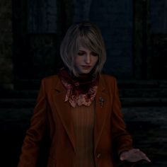 a woman with blonde hair wearing a brown jacket and red scarf standing in the dark