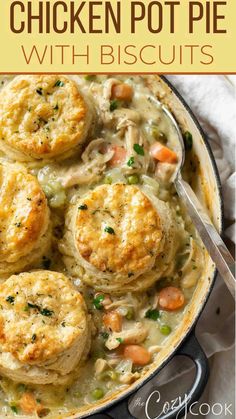 chicken pot pie with biscuits in a skillet on top of a table