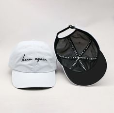 Another excellent way to "Wear What You Believe!” The “Born Again” collection debuts with our fully custom caps in classic black and white shades – making them a versatile staple for any wardrobe. This hat has both an elevated meaning and elevated style with an athletic touch. Good Form should Have Good Function: It is not necessary to compromise substance and quality for appealing aesthetics… We chose a high-grade, feather-light nylon textile with a subtle but stylish satin sheen that is antimi White Adjustable Trucker Hat, Everyday White Six-panel Baseball Cap, White Baseball Cap With Curved Brim And Adjustable Fit, White Baseball Cap With Adjustable Fit And Curved Brim, White Adjustable Snapback Cap, White Adjustable Fit Snapback Hat, White Six-panel Snapback Hat, White Six-panel Snapback Hat For Everyday, White Adjustable Snapback Hat