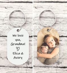 two keychains with the words we love you, grandma and eli & avery on them