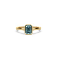 Fancy Blue Emerald Diamond Bezel Engagement Ring is made with an fancy Blue emerald cut diamond set in a bezel setting on a solid gold band. Details: - Made to Order- Diamond Weight: 1.00 CT, 1.50 CT, 2.00 CT, 2.50 CT, 3.00 CT- No. Of Diamonds: 1- Diamond Cut: Emerald- Diamond Type: Lab Grown Diamond (CVD, HPHT)- Diamond Clarity: VS - Diamond Color: Fancy Blue- Setting Type: Bezel - Metal Type: 14K Solid Gold,18K Solid Gold- Choice of Gold Color: Yellow Gold, White Gold, Rose Gold- Jewelry Certi Bezel Set Engagement Ring, Bezel Engagement Ring, Solid Gold Band, Halo Earrings, Vs Diamond, Fancy Diamonds, Diamond Charm, Fancy Color Diamonds, Diamonds And Gold