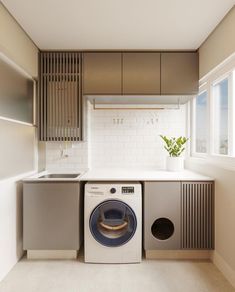 a washer and dryer in a very small room with no one around it