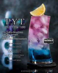 a blue and purple drink with a lemon slice on top