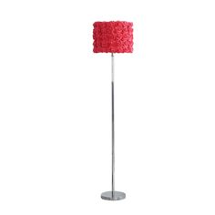 a floor lamp with a red rosette shade