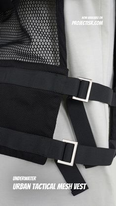 there is a black belt attached to the back of a white shirt with mesh on it