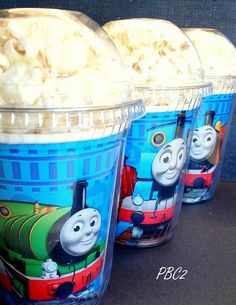 three plastic cups filled with ice cream and thomas the tank engine