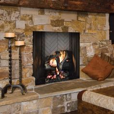 a stone fireplace with two people hugging each other