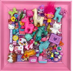 a pink frame filled with lots of toys