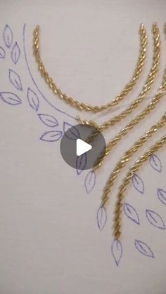 the gold chain is being drawn on paper