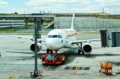 an airplane is parked on the tarmac