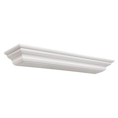 a white crown moulding on the ceiling above a toilet paper dispenser