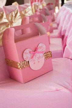 some pink bags with minnie mouse designs on them