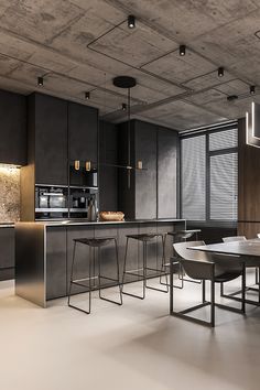 a modern kitchen and dining room are shown in this image, with dark wood paneling on the walls