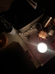 an overhead view of a kitchen counter with light coming through the hole in the middle