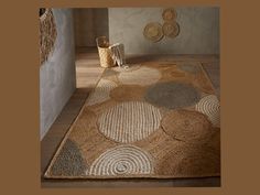 a brown rug with circles on it in a room