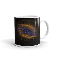 a coffee mug with an image of a spiral galaxy