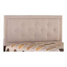 an upholstered headboard with buttons on the top and bottom part of it