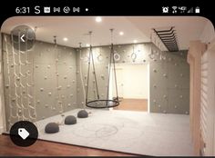 an empty room with swings and balls on the floor