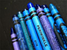 blue and purple crayons lined up in a row