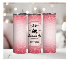 two pink glitter tumblers sitting next to each other