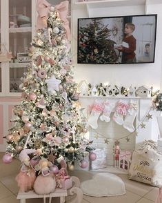 a decorated christmas tree with pink and white ornaments