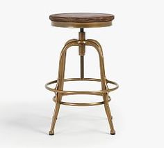 a stool with a wooden seat and foot rest on an isolated white background for use in commercial projects