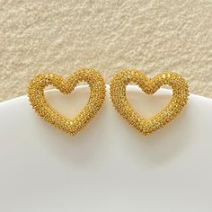 Yellow diamond earrings featuring fancy yellow stones in an pave setting in heart shape. Ideal to pair with your prom gowns or any special occasion drees. These canary yellow diamond earrings surely elevate your look. Perfect gift for her. *𝐏𝐑𝐎𝐃𝐔𝐂𝐓 𝐃𝐄𝐓𝐀𝐈𝐋* * 𝐌𝐚𝐭𝐞𝐫𝐢𝐚𝐥: Brass * 𝐏𝐥𝐚𝐭𝐢𝐧𝐠: Gold Plated * 𝐒𝐭𝐨𝐧𝐞: AAA-quality CZ Diamond. *𝐃𝐈𝐌𝐄𝐍𝐒𝐈𝐎𝐍𝐒* * 𝐖𝐞𝐢𝐠𝐡𝐭: 5 gm each * 𝐋𝐞𝐧𝐠𝐭𝐡: 2.5 cm * 𝐖𝐢𝐝𝐭𝐡: 2.7 cm * 𝐂𝐥𝐨𝐬𝐮𝐫𝐞: Push Back 𝐕𝐢𝐬𝐢𝐭 𝐎𝐮 Yellow Diamond Earrings, Canary Yellow Diamonds, Sapphire Earring, Yellow Diamond Earring, Statement Stud Earrings, Earrings Luxury, Earrings Big, Canary Yellow, Yellow Stone