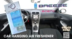 a car hanging air freshener in the passenger seat with an ad for breezecent