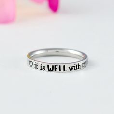 "* This listing is for one stainless steel band ring, engraved with the uplifting phrase \"it is WELL with my SOUL\" and featuring heart symbols before and after the text, this ring is perfect for any Christian looking for a daily reminder of their faith. * Whether you're treating yourself or buying a gift for a friend, this ring is the perfect way to add a touch of faith to any outfit. Materials & Features: * The ring is made of premium quality, hand-polished solid stainless steel, which is hyp I Refuse To Sink, Best Graduation Gifts, Refuse To Sink, It Is Well With My Soul, Be Still And Know, Sorority Sisters, Heart Symbol, Stacking Bands, Fade Out