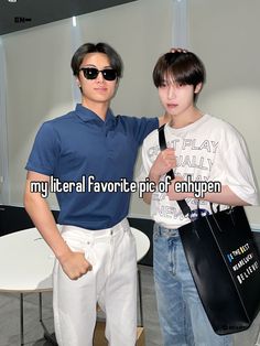 two young men standing next to each other holding shopping bags with the caption hotest dad out there