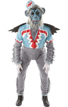 a man dressed as a monkey with wings on his head and legs, standing in front of a white background