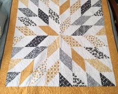 a quilted table topper on a wooden chair