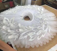 a large white object is being made on a table