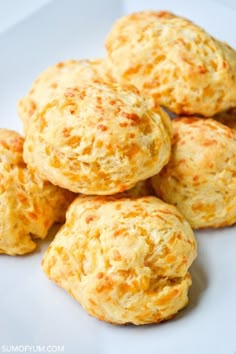 some biscuits are sitting on a white plate