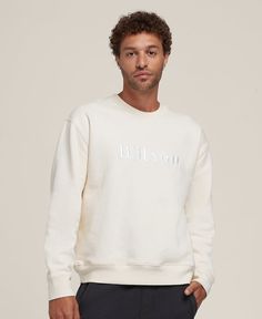 The cozy sweatshirt to grab for warm-ups, chilly gym commutes or long recovery days. Dense and impossibly soft, the Wilson America Crewneck comes in heavyweight cotton that feels lived-in from the start. It's made in the USA with all the marks of a classic, from the V-stitch collar to the easy, co-ed fit. | Wilson Men's Wilson America Crewneck Everyday Sportswear Sweats With Ribbed Cuffs, Relaxed Fit Sports Sweats With Logo Print, Sporty Cotton Fleece Sweatshirt With Ribbed Cuffs, Sporty Fleece Sweatshirt, Sporty Everyday Sweatshirt With Ribbed Cuffs, Sporty French Terry Sweatshirt For Everyday, Sporty Fleece Sweatshirt For Everyday, Sporty Cotton Sweater For Everyday Use, Sports Sweatshirt With Embroidered Logo And Relaxed Fit