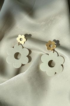 DESCRIPTION Flower shaped drop earring Post backing Gold accents Wood material Wood Earring, Earring Post, Wood Material, Drop Earring, Wood Earrings, Flower Shape, Gold Accents, Post Earrings, Drop Earrings